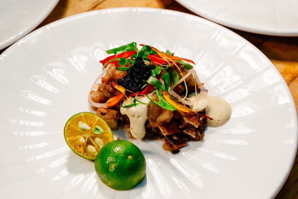 Filipino sisig, a sizzling chopped pork dish with calamansi